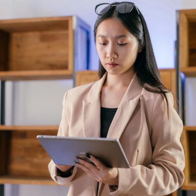 A Businesswoman Looking at a Tablet