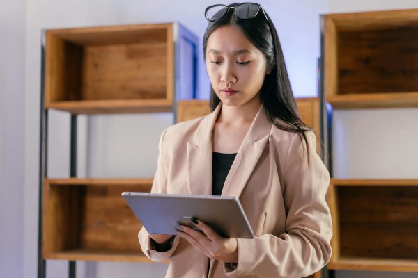 A Businesswoman Looking at a Tablet